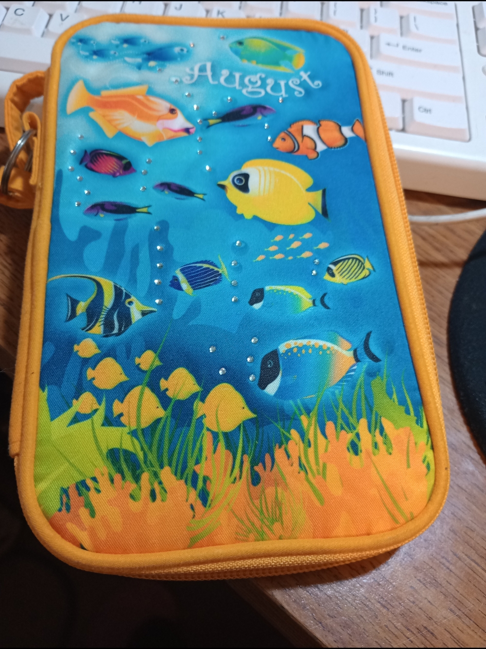 August  Danberry. Mint. Fish Print Travel Wristlet Blue & Orange